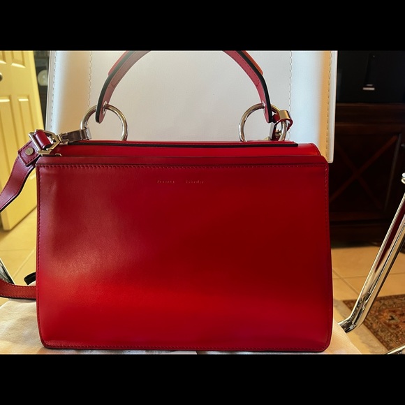 Proenza SchoulerDepth:4.75"
Strap 20"
Width:12.5"
Handle Drop:5.25"
Height:9.75” - Picture 3 of 10